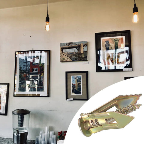 50 Pcs Self Drilling Drywall Anchors And Screws Kit Zinc Plated Steel Wall Anchors With Self Tapping Screws in front of framed artwork.