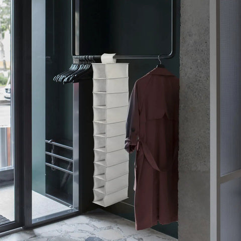 Hanging shoe organizer bag with ten spacious pockets made from heavy duty nonwoven fabric, ideal for clutter-free dorm beds.