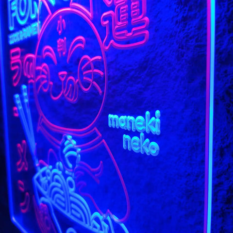 Close-up of a Beckoning Cat Neon Sign for Wall Decor LED Luck Light With Ramen Theme, featuring blue and red Japanese motifs, 16x24 inches.