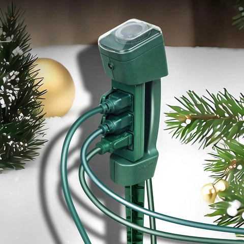 Heavy Duty Outdoor Power Stake With Three Grounded Outlets And Smooth Twist Socket Cover Featuring Dusk Till Dawn Photocell Timer in green with cables.