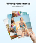 Hand holding photo prints showcasing clear and vivid colors, illustrating printing performance with 67XL Printer Ink Replacement.