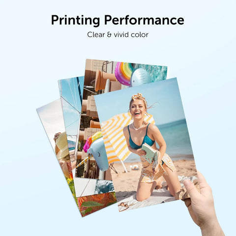 Hand holding photo prints showcasing clear and vivid colors, illustrating printing performance with 67XL Printer Ink Replacement.