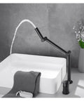 Faucet, Desk Mounted 360 Rotate Foldable Basin Faucet Mixer Hot and Cold Sink Tap Rotate Folding Spout Kitchen Matter Black in use with water.