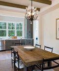 Dining room with Vintage K9 Clear Crystal 3-Light Pendant Ceiling Fixture, black finish, 39-inch chain, above table.