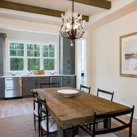 Dining room with Vintage K9 Clear Crystal 3-Light Pendant Ceiling Fixture, black finish, 39-inch chain, above table.