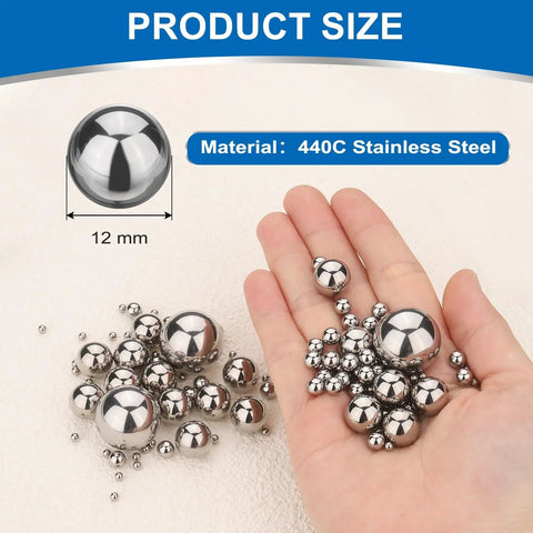 Kickass Heavy Duty 10 Piece 12mm 440C Stainless Steel G10 Precision Bearing Balls in hand with various sizes.