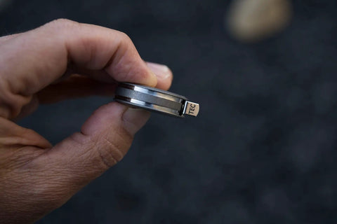 Ultra Tiny Titanium Ti Tape Retractable Mini Tape Measure With 3 Feet Range, Imperial And Metric, side view in hand