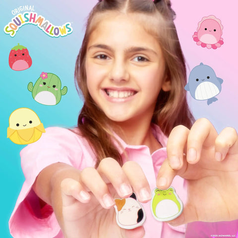 Girl holding Squishmallows 25 Piece Mini Eraser Set With Cute Cartoon Characters Like Banana Cactus Frog And More