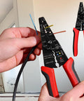 Close-up of All In One 8 Inch Wire Stripper Cutter Crimping Tool For 10 To 22 AWG Cables With Screw Cutting Feature in use