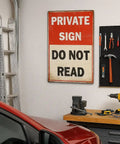 Funny Private Sign Do Not Read Tin Metal Wall Decor Vintage Rustic Distressed Hella Cool Art Piece for Man Cave Bedroom Bar Dorm Office Gift 12 by 8 Inch, mounted in a garage with tools.