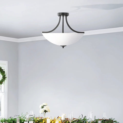 Geary Small Two Light Semi Flush Convertible Pendant Light In Midnight Black Modern Hanging Fixture in dining room setting.