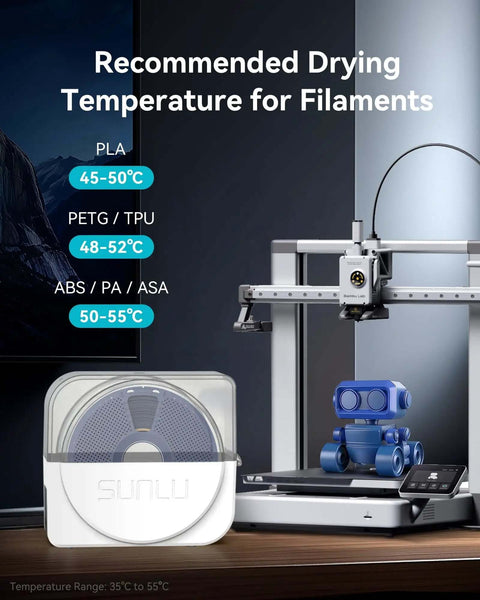 Filament Dryer And Storage Box With Built In Circulation Fan For 3D Printer Filaments on desk, 3D printer and robot model beside.