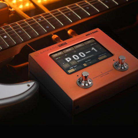 Ampero Mini MP-50 Guitar and Bass Amp Modeling Console With IR Cabinets on a dark surface next to a guitar neck