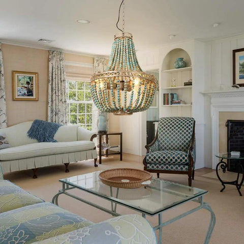Three Light Wood Beaded Chandelier in Rustic Farmhouse Vibe hanging in a cozy living room with vintage decor.