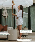 Patio Must Have Weatherproof Umbrella Side Table With Hole Durable Plastic Stone Combo by poolside, showing side table use.