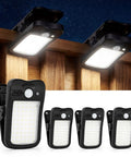 Clip On Solar Lights 4 Pack With 60 LED 500LM Motion Sensor USB And Solar Powered Waterproof Security Lights clipped on a fence.