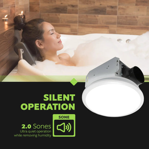 Woman relaxing in a bathtub with Whisper Quiet Integrated LED Light Ceiling Mount Bath Exhaust Fan 110 CFM 2.0 Sones