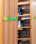 Clear Acrylic Door Name Plates 2x8 Inches 5 Pack With Adhesive Tape Easy Paper Insertion mounted on wood bookshelves