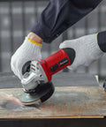 Powerful 4.5 Inch Angle Grinder With 7.5 Amp Motor And 11000 Rpm for rust removal on metal surface in use.