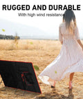 Solar Panel Tilt Mount Stand For Foldable Panels in a field with a person, lightweight stainless steel bracket visible