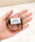 DC Buck Converter Module 24V-12V To 1.5V, 3A Output, 4.5W Power Regulator With 13cm Cable shown in hand