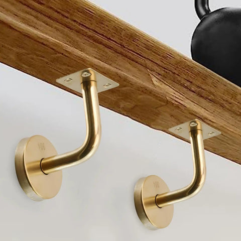 Gold finish stainless steel handrail brackets wall mounted on a wooden beam, square railing holders with base covers and screws visible