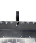 Half Inch Wide Round Silicone Rubber Bumper Feet Pads One Eighth Inch Thick With Adhesive Backing beside ruler for size reference.