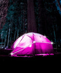 Camping tent lit with Battery Powered LED Strip Lights 13ft USB And Battery Operated RGB Color Changing LEDs in a forest.