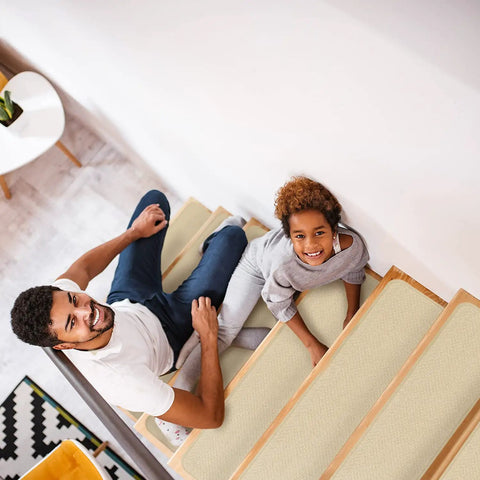 Family sitting on stairs with Skid Resistant Carpet Stair Treads Set Of 15 In Ivory Cream 8 X 27 Inches With No Slip Backing