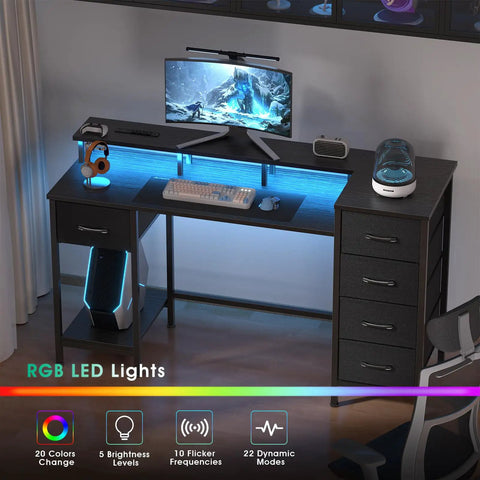 47 Inch Gaming Desk With Power Outlets And LED Lights Reversible Computer Desk With Five Fabric Storage Drawers Monitor Stand For Home Office And Study Setup Vibe Black displaying LED lights and storage drawers.