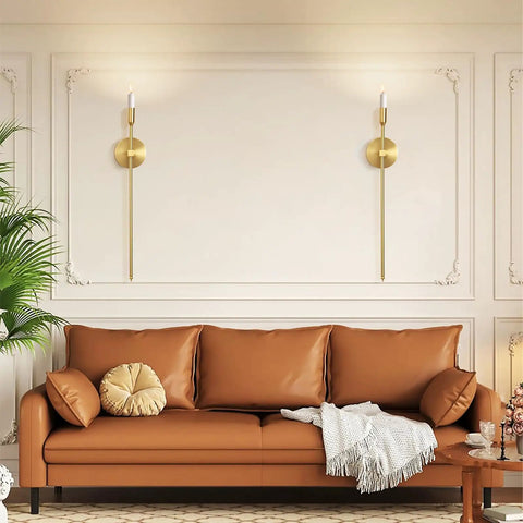 Sleek Gold Wall Candle Sconces Set Of Two Large 23 Inch Modern Light Fixtures For Bedroom Dining Room And Living Room Chic Home Decor That Delivers Major Flex Ambiance Always, displayed beside a brown sofa.