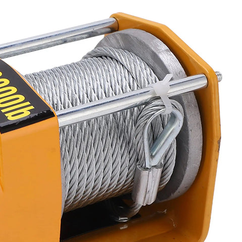 Heavy Duty 12V Electric Winch Kit featuring 3000 LB towing capacity with stainless steel cable detail close-up.