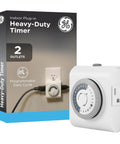 24 Hour Mechanical Outlet Timer Switch With Dual Grounded Plug In Control next to product packaging