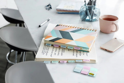 Sweet Repositionable Sticky Tabs For Books And Notes Durable Page Markers In Blue Green Yellow And Red Simple To Swap on a notebook.