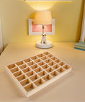 Top Tier Solid Wood Jewelry Tray Organizer with 36 grids on a desk, showcasing solid wood design for neat storage.
