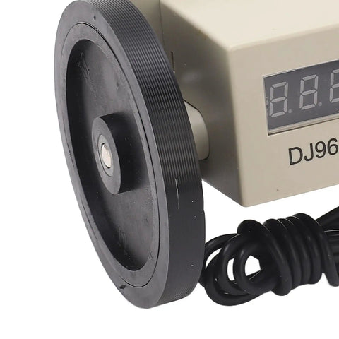 Digital Metric Distance Measuring Wheel close-up showing counter display and rubber wheel for site layout work.