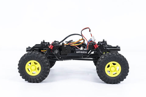 1/18 RC Crawler Pro Juice Up Edition RTR With HBW Electronics, side view showing chassis and yellow wheels.