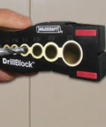 Handheld Drill Guide Block For Precision Drilling Handy Drill Jig With Centerlines Non Slip Feet And Dual V Grooves in use on tile