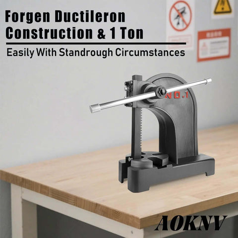 Beefy 1 Ton Manual Arbor Press With Hand Wheel on a wooden table, for punching, stamping, bending, and forming leather and metal.