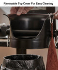 Removable top cover of White Matte Knock Box For Espresso Machines Vertical Coffee Grounds Dump Bin shown above trash bin.