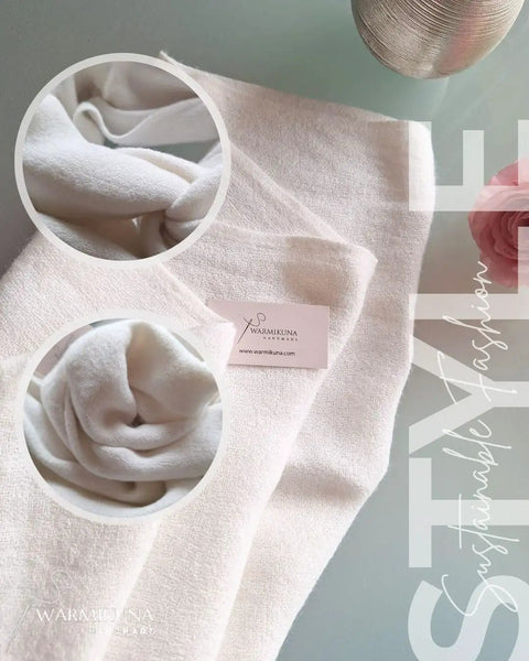Ultra Cozy Winter Cashmere Infinity Scarf In Beige, folded showcasing plush soft knit and loop style, on display with brand card