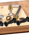 Bulletproof Heavy Duty Lock Screws And Nuts For Furniture Assembly, Black Cross Dowel Bolts and bed frame mounts on wood.