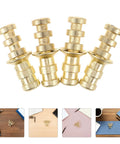 Gold-finish metal table pins and dowels set for furniture joints and desk assembly; alignment pins and bolt sleeves for quick fixes