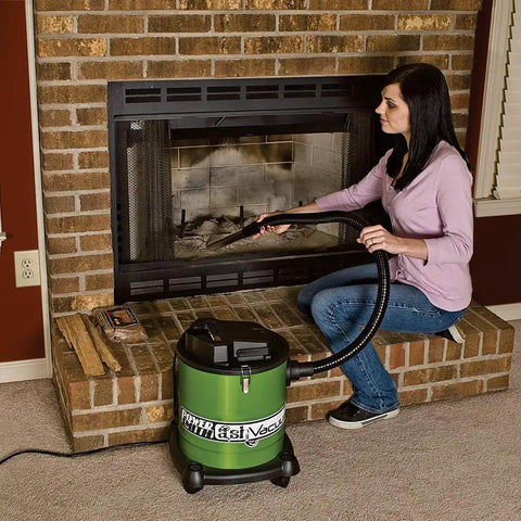 Person using All Purpose Ash Vacuum For Fireplaces And Grills With 10 Amp Power in brick fireplace cleaning ash