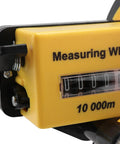 Close-up of measuring wheel with foldable telescopic handle, 0-9999.9m range, showing yellow casing and distance tracker.