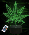 3D Illusion Night Light With Remote, 16 Color Changing LED Lamp featuring green leaf design over black base