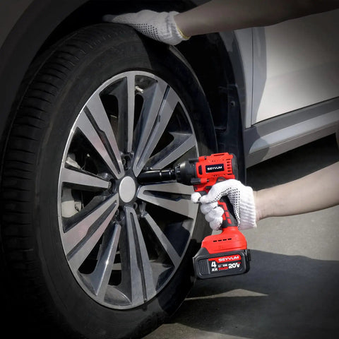 Person using Cordless Half Inch Impact Wrench Beast Delivers 320 Ft Lbs Max Torque, 20V Brushless Motor, 4.0Ah Battery With Fast Charger on car tire