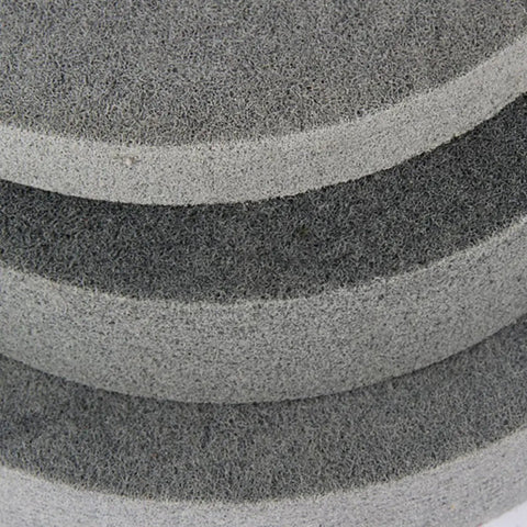 Close-up of nylon fiber polishing wheel in 5 pack for metal and wood polishing in automotive and aerospace jobs, pro grade buffing kit.