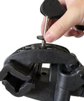 Close-up of hand adjusting clamp on Heavy Duty Bicycle Repair Stand And Pro Grade Repair Tools YC-100-R for home garage use
