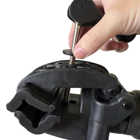 Close-up of hand adjusting clamp on Heavy Duty Bicycle Repair Stand And Pro Grade Repair Tools YC-100-R for home garage use